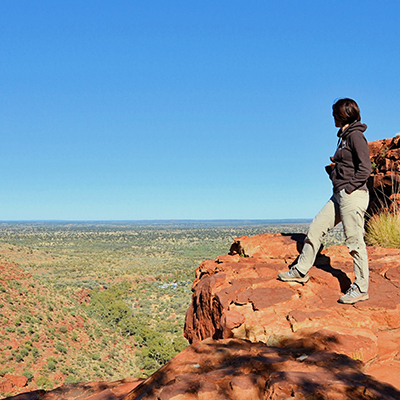 Travel Nurse in Kings Canyon Australia overlooking scenery.